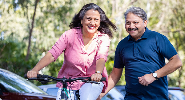 happy Indian senior couple enjoying retirement, traveling and pursuing hobbies, financial freedom concept